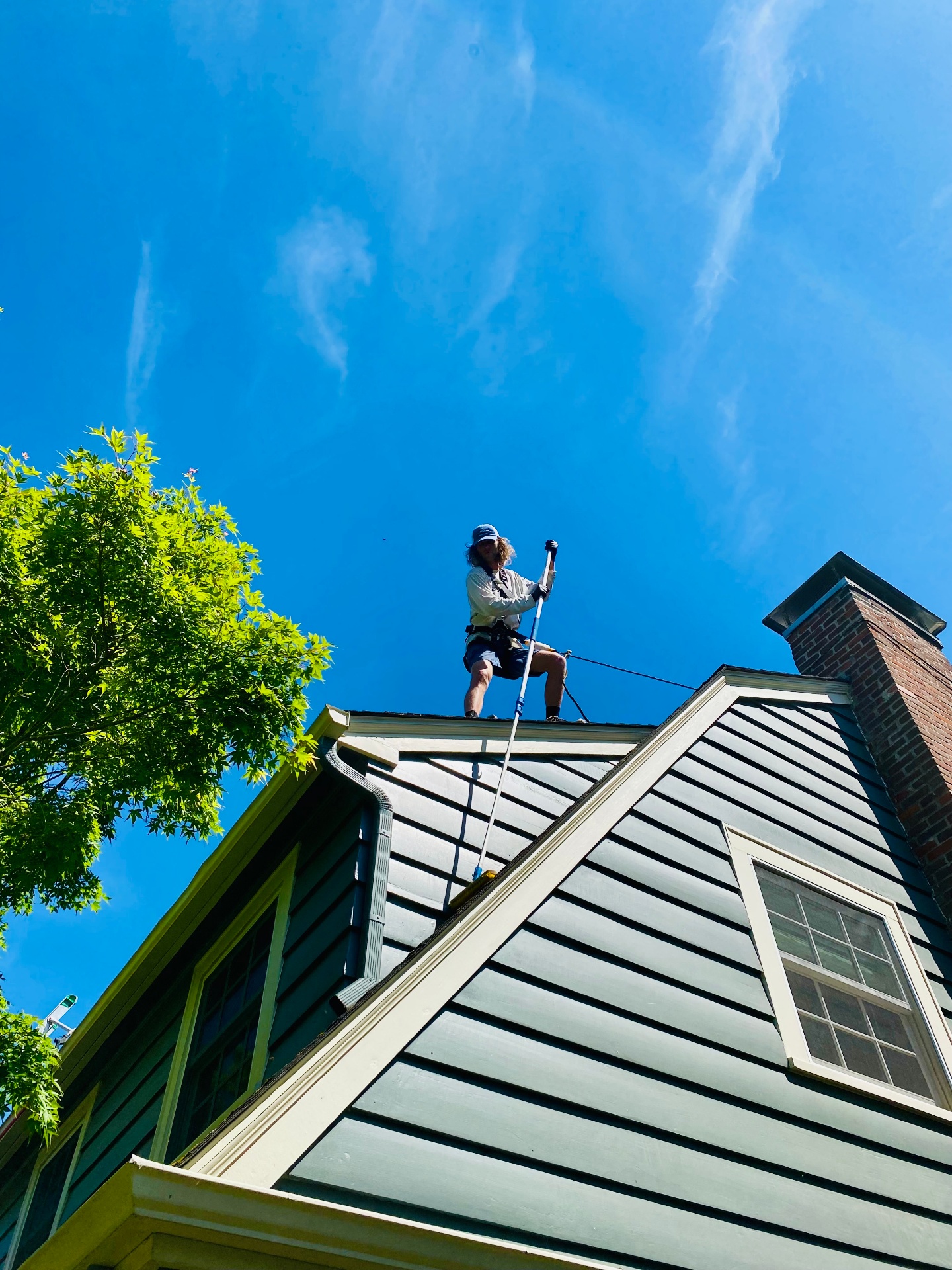 Roof cleaning specialist working in Portland